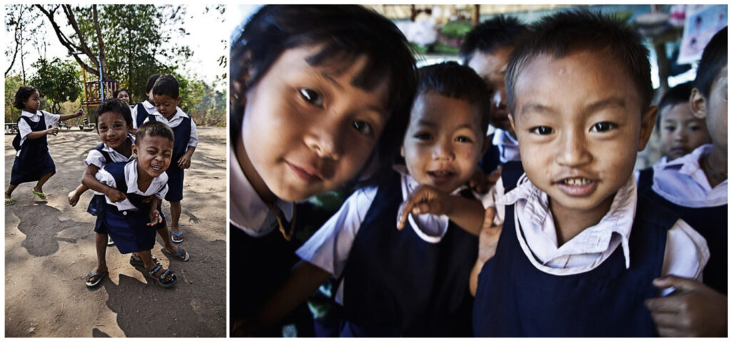 burmesische Kinder in einer Schule in Thailand spielen vor der Kamera und kommen sehr nah